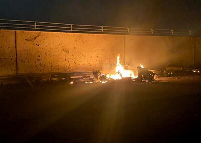 TOPSHOT - A picture published by the media office of the Iraqi military's joint operations forces on their official Facebook page shows a destroyed vehicle on fire following a US strike on January 3, 2020 on Baghdad international airport road in which top Iranian commander Qasem Soleimani was killed along with eight others, including the deputy head of Iraq's powerful Hashed al-Shaabi paramilitary force. Early Friday, a volley of US missiles hit Baghdad's international airport, striking a convoy belonging to the Hashed al-Shaabi, an Iraqi paramilitary force with close ties to Iran. Soleimani was killed in the US strike on the Iraqi capital's airport, according to Hashed, in a dramatic escalation of tensions between Washington and Tehran. - === RESTRICTED TO EDITORIAL USE - MANDATORY CREDIT "AFP PHOTO / HO / IRAQI MILITARY" - NO MARKETING NO ADVERTISING CAMPAIGNS - DISTRIBUTED AS A SERVICE TO CLIENTS ===
 / AFP / IRAQI MILITARY / - / === RESTRICTED TO EDITORIAL USE - MANDATORY CREDIT "AFP PHOTO / HO / IRAQI MILITARY" - NO MARKETING NO ADVERTISING CAMPAIGNS - DISTRIBUTED AS A SERVICE TO CLIENTS ===
