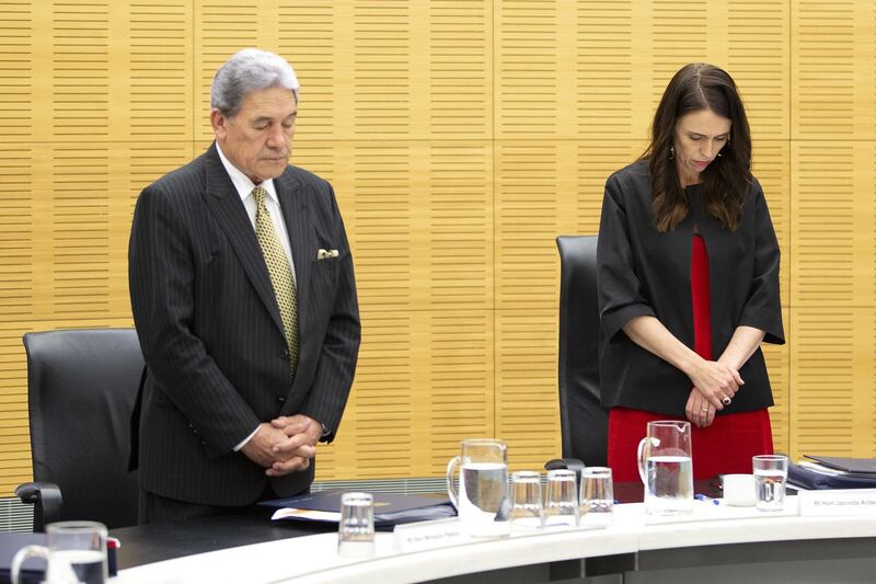 New Zealand Prime Minister Jacinda Ardern (R) and deputy Winston Peters (L) observe a minute of silence for victims of the White Island tragedy during a cabinet meeting in Wellington, New Zealand.  EPA