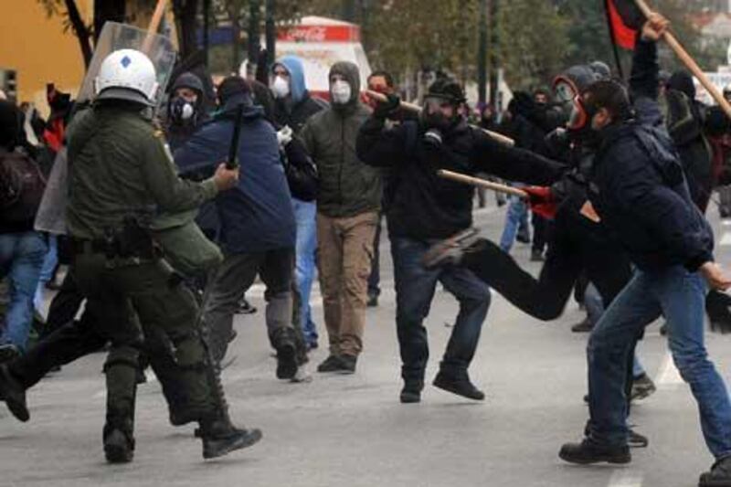 Protestors clash in front of the Greece parliament in Athens yesterday.