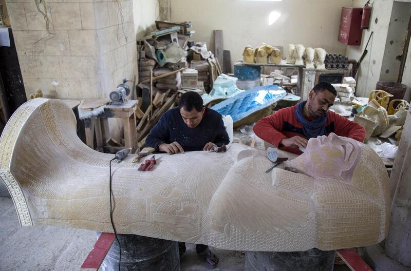 Artist work on a replica of a Pharaonic statue at the Replica Production Unit located at Salah Al Din Citadel in Cairo, Egypt. EPA