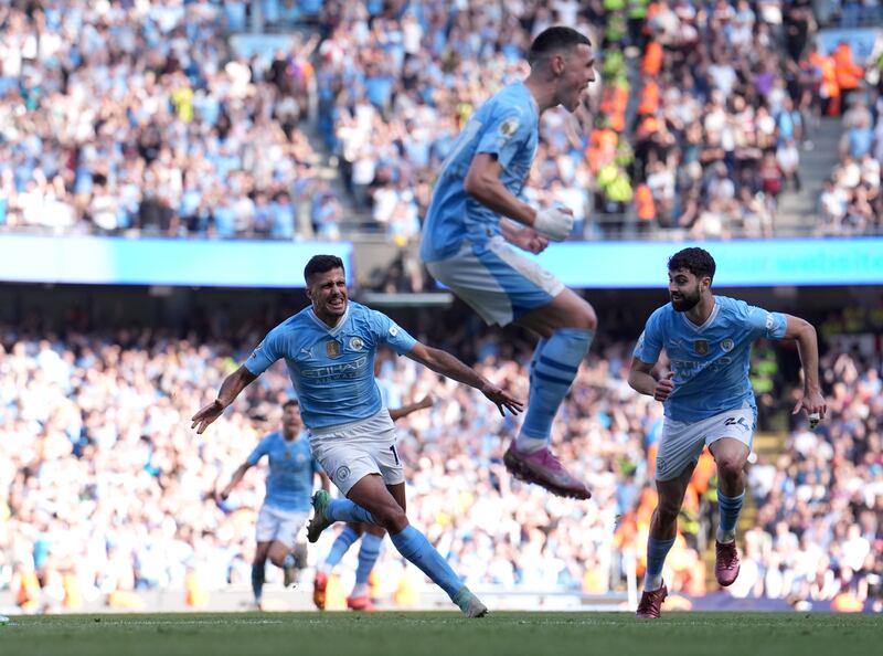 Manchester City's Phil Foden celebrates Rodri's goal. PA 