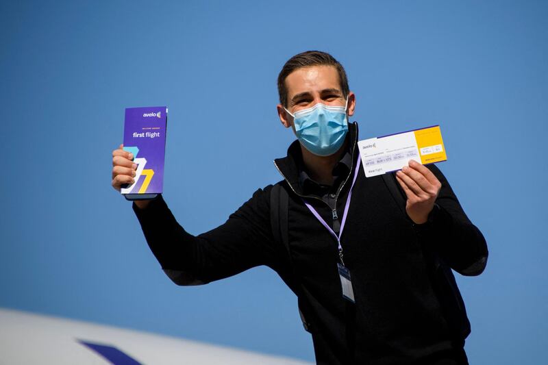 Passengers on the first flight recieved a commemorative first flight boarding pass. AFP