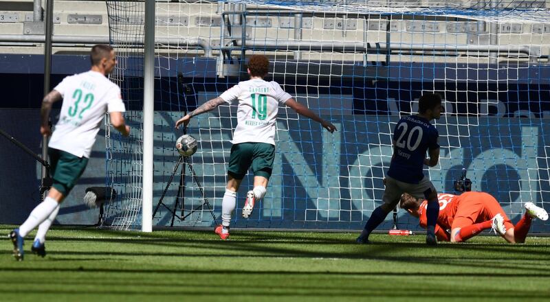 Schalke goalkeeper Alexander Nuebel cannot stop Leonardo Bittencourt scoring for Bremen. EPA