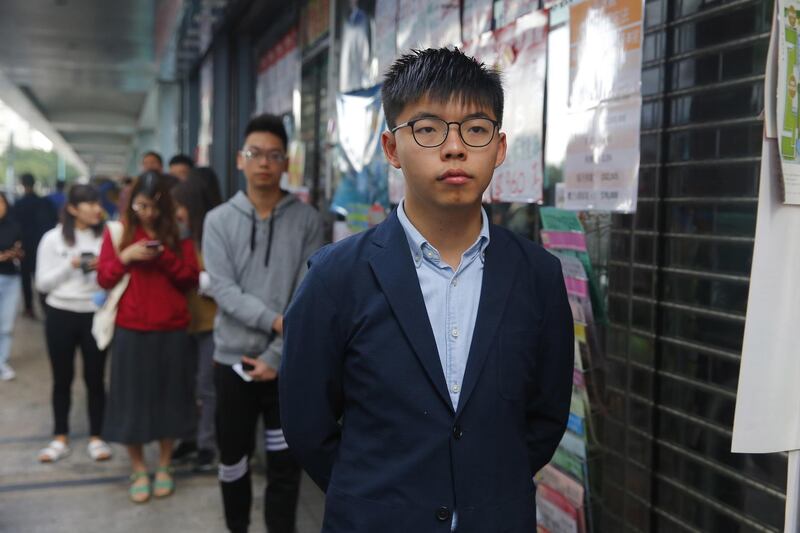 Joshua Wong, pro-democracy activist and secretary-general of the Demosisto party, arrives to cast his vote.  EPA