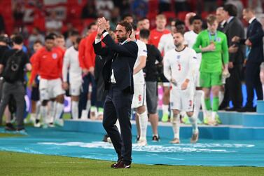England's coach Gareth Southgate applauds supporters after England lost to Italy in the UEFA EURO 2020 final football match between Italy and England at the Wembley Stadium in London on July 11, 2021.  (Photo by Paul ELLIS  /  POOL  /  AFP)