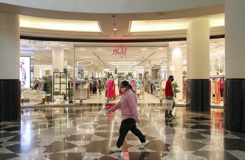 DUBAI, UNITED ARAB EMIRATES , April 29 – 2020 :- Shoppers wearing protective face mask to prevent the spread of the coronavirus at Mall of the Emirates in Dubai. Authorities ease the restriction for the residents in Dubai. At present mall opening timing is 12:00 pm to 10:00 pm. (Pawan Singh / The National) For News/Standalone/Online. Story by Patrick