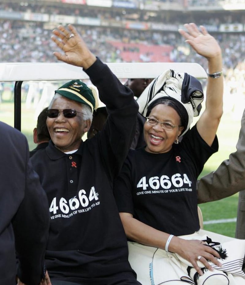 Mandela and his wife Graca Machel prior to the Nelson Mandela Challenge Plate international rugby match between South Africa and Australia in 2005. David Rogers / Getty Images