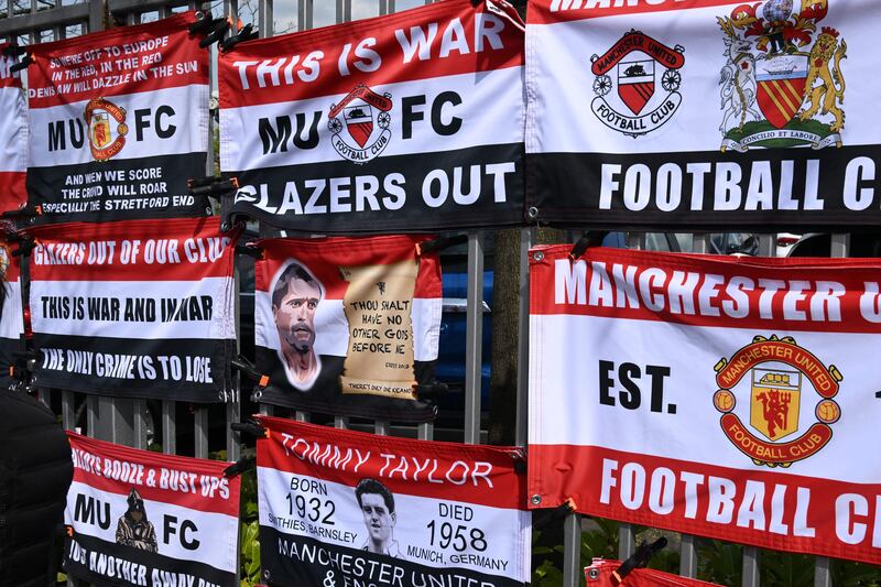 Anti-Glazer messages are seen on flags displayed for sale outside Manchester United's Old Trafford stadium. AFP