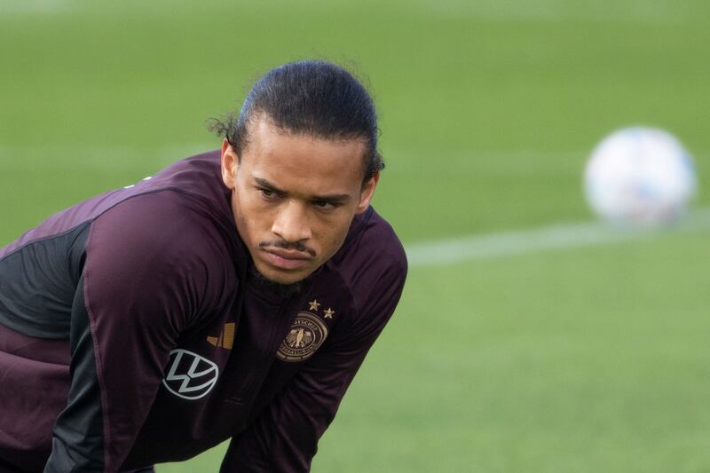 Germany winger Leroy Sane takes a rest during training. AFP