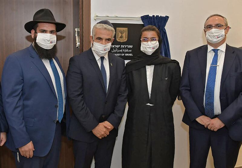 Left to right, Rabbi Levi Duchman, Israeli Foreign Minister Yair Lapid, Minister of Culture and Youth Noura Al Kaabi, and Israeli Foreign Ministry director general, Eitan Na'eh during the inauguration of the Israeli embassy in Abu Dhabi. AFP