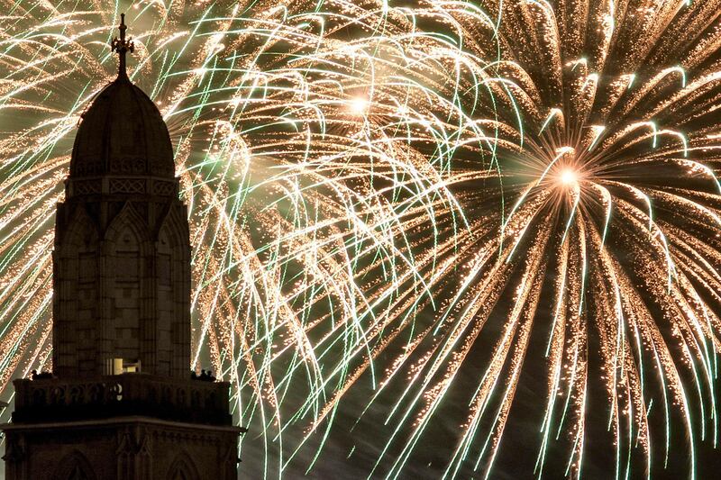 epa03046535 Fireworks light the sky above the Grossmuenster church in Zurich, Switzerland, during the New Year celebrations, 01 January 2012.  EPA/ALESSANDRO DELLA BELLA *** Local Caption ***  03046535.jpg