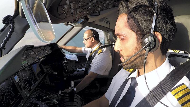 Captain Al Tamimi and his co-pilot on the flight deck.