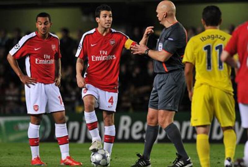 The Arsenal captain Cesc Fabregas, second left, complains to the referee during the match against Villarreal at El Madrigal.