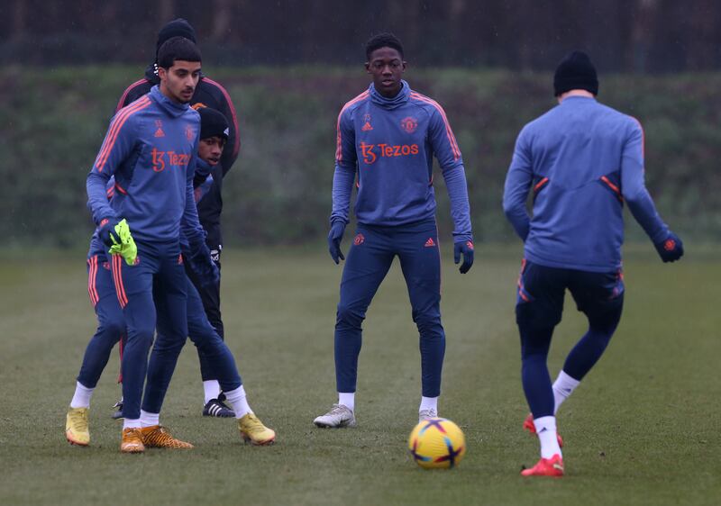 Manchester United's Zidane Iqbal and Kobbie Mainoo with teammates during a training session in Carrington on Thursday, December 22, 2022. Getty