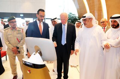 Tim Clark, president of Emirates airlines (centre) during the opening of Emirates City Check –In and travel store at ICD Brookfield Place in DIFC in Dubai. Pawan Singh / The National