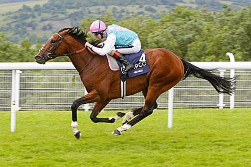 The jockey Tom Queally urges Frankel on to win the Sussex Stakes from rival Canford Cliffs by five lengths.