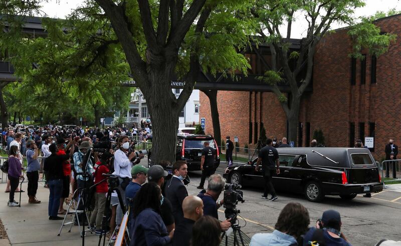 A hearse carrying a casket of George Floyd departs. Reuters