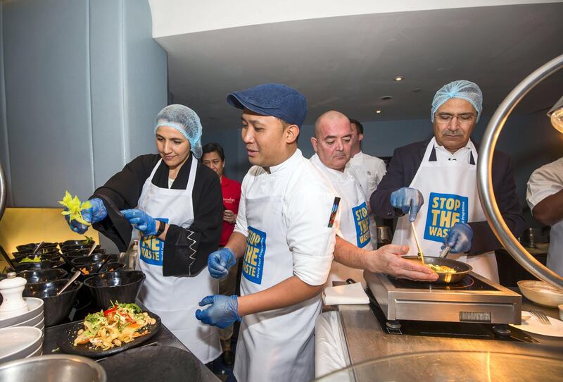 Dubai, United Arab Emirates - HE Mariam Almheiri, Minister for Food Security and Mageed Yahia,  Director of WFP office in the UAE & Representative to the GCC trying a leftover food recipe at World Food Programme Stop the Waste campaign at Jumeirah Beach Hotel, Dubai.  Leslie Pableo for The National