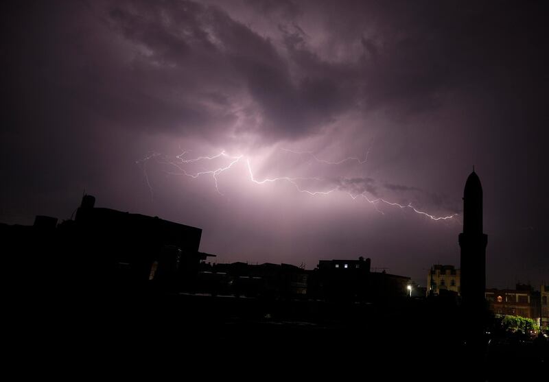 Lightning bolts illuminate the sky during a thunderstorm over Sanaa, Yemen.  EPA