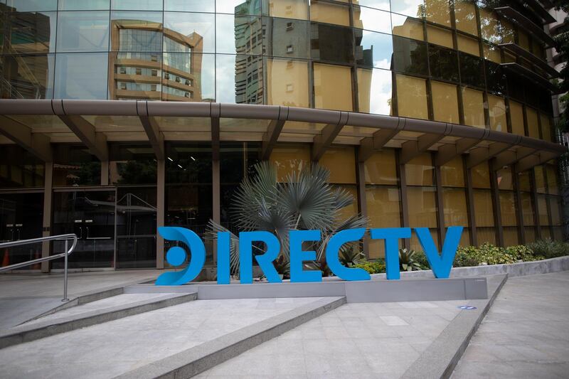A DirectTV logo identifies the company's headquarters in Caracas, Venezuela, Friday, May 22, 2020. Venezuelaâ€™s high court ordered on Friday the immediate seizure of all DirecTV property, days after the U.S. firm abandoned its services in the South American nation, citing U.S. sanctions. (AP Photo/Ariana Cubillos)