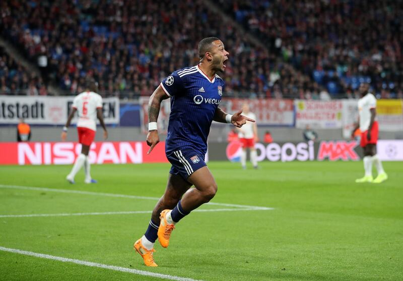 LEIPZIG, GERMANY - OCTOBER 02: Memphis Depay of Olympique Lyon celebrates after scoring his sides first goal during the UEFA Champions League group G match between RB Leipzig and Olympique Lyon at Red Bull Arena on October 02, 2019 in Leipzig, Germany. (Photo by Christian Kaspar-Bartke/Bongarts/Getty Images)