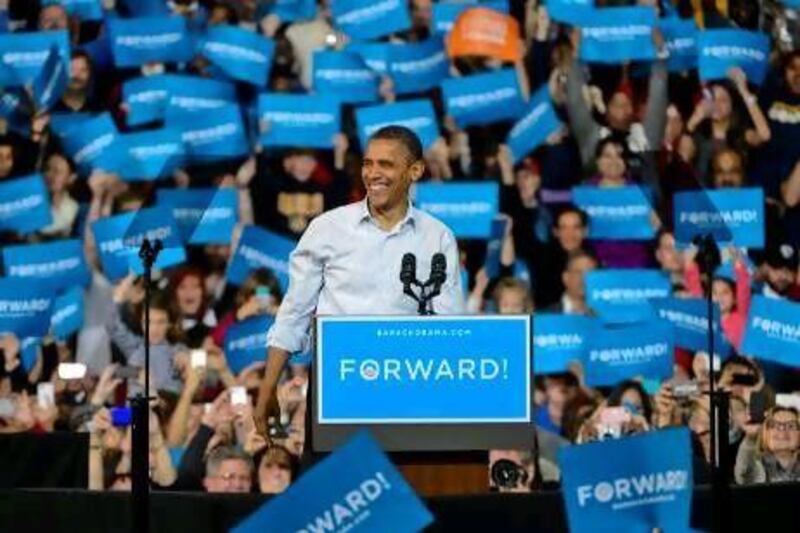 President Obama takes the stage at a campaign stop at the Delta Centre in Milwaukee, Wisconsin.