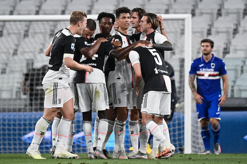 Juventus  forward Cristiano Ronaldo celebrates with teammates after scoring against Sampdoria at the Allianz Stadium in Turin. AFP