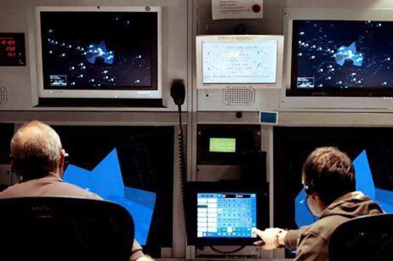 Air traffic controllers keep an eye on the radar screen at Dubai International Airport. Stephen Lock / The National