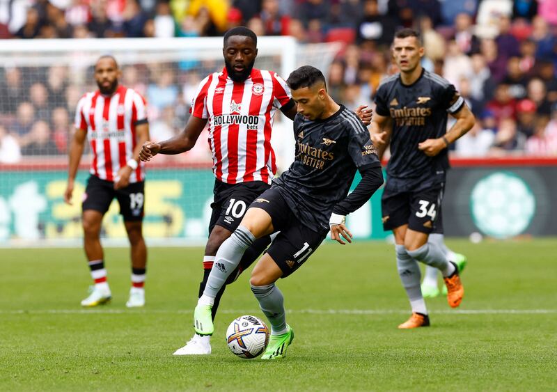 Arsenal's Gabriel Martinelli in action with Brentford's Josh Dasilva. Reuters