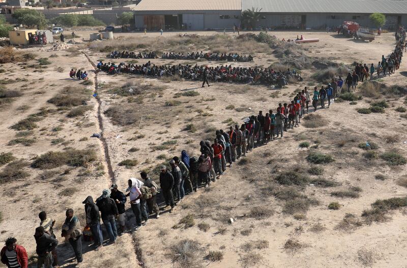 Migrants wait to be transported to a detention center, in the coastal city of Sabratha, Libya. Hani Amara / Reuters