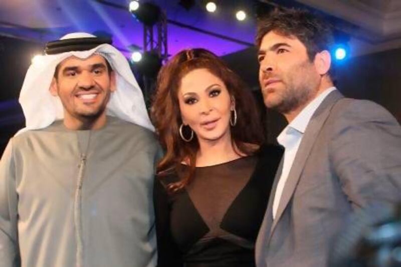The Lebanese pop stars Wael Kfoury, right, and Elissa, centre, with the Emirati singer Hussein Al Jasmi. AFP