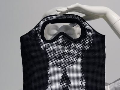 A bag featuring the face of Karl Lagerfeld is displayed at the Metropolitan Museum of Art exhibition Karl Lagerfeld: A Line of Beauty. AP