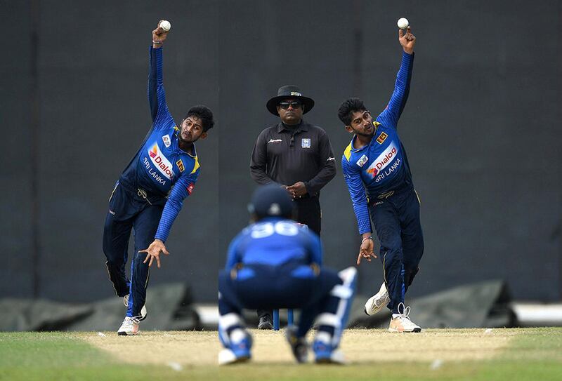 In this composite image prepared by our photo editor James O'Hara, you will find Kamindu Mendis bowling with both arms in a tour match against England. Getty Images