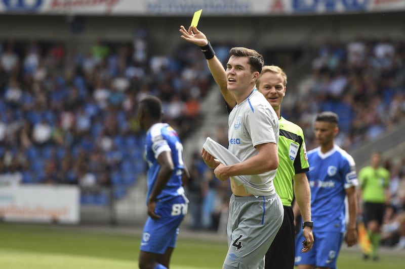 GENK, BELGIUM - JULY 22: Michael Keane from Everton receives a yellow card during the Pre-Season Friendly between KRC Genk and Everton at Cristal Arena on July 22, 2017 in Genk, Belgium (Photo by Andy Astfalck/Getty Images)
