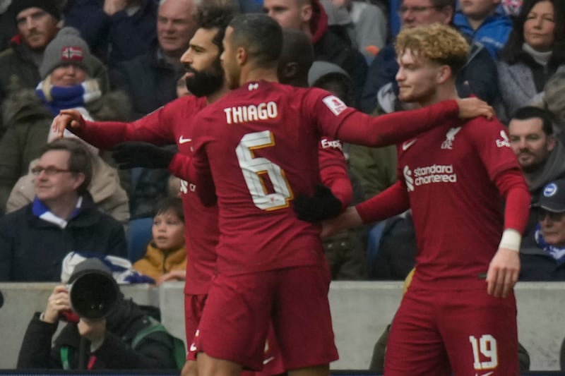 Elliott celebrates with Thiago and Mohamed Salah. AP