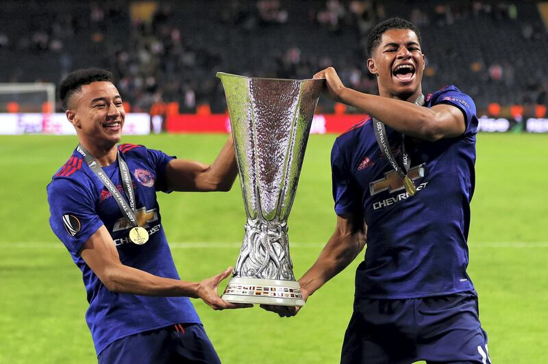 STOCKHOLM, SWEDEN - MAY 24: Jesse Lingard (L) and Marcus Rashford of Manchester United celebrate with the trophy following the UEFA Europa League Final match between Ajax and Manchester United at Friends Arena on May 24, 2017 in Stockholm, Sweden. (Photo by Chris Brunskill Ltd/Getty Images)