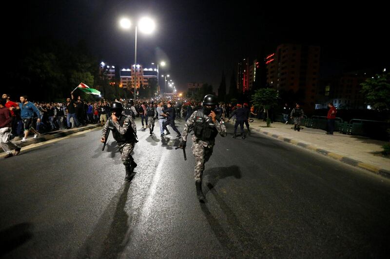 Demonstrators clash with riot police. Muhammad Hamed / Reuters