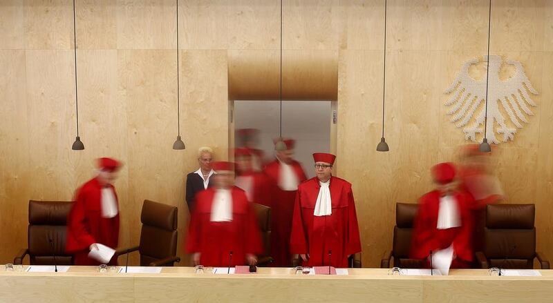 Andreas Vosskuhle (C) President of Germany’s Constitutional Court arrives to pronounce the verdict on the European Stability Mechanism.   Kai Pfaffenbach / Reuters