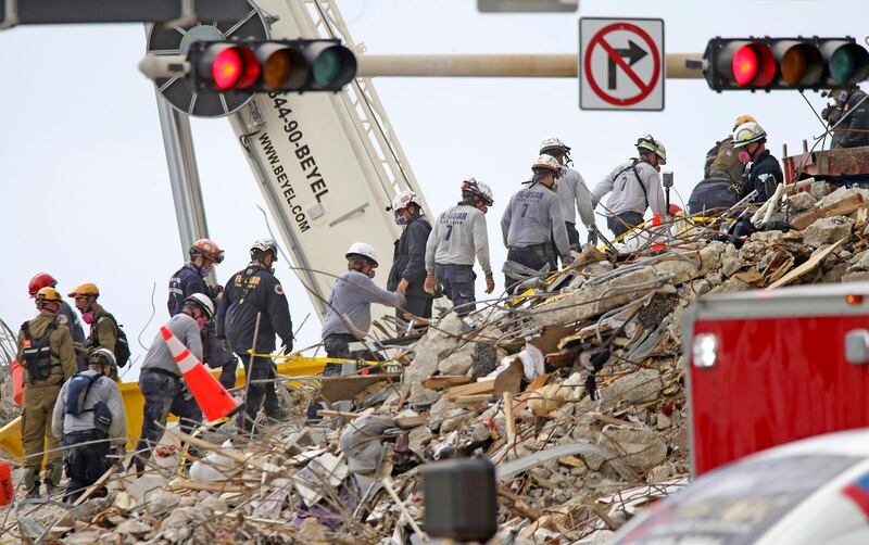 Rescue work continues at what was the north-west corner of Champlain Towers South. Miami Herald via AP