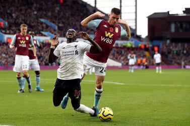 Liverpool's Sadio Mane goes down in the area under the challenge from Aston Villa's Frederic Guilbert and is booked for diving during the Premier League match at Villa Park, Birmingham. PA Photo. Picture date: Saturday November 2, 2019, See PA story SOCCER Villa. Photo credit should read: Nick Potts/PA Wire. RESTRICTIONS: EDITORIAL USE ONLY No use with unauthorised audio, video, data, fixture lists, club/league logos or "live" services. Online in-match use limited to 120 images, no video emulation. No use in betting, games or single club/league/player publications.