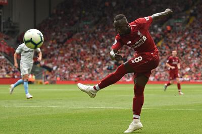 Liverpool's Guinean midfielder Naby Keita shoots wide during the English Premier League football match between Liverpool and West Ham United at Anfield in Liverpool, north west England on August 12, 2018. (Photo by Oli SCARFF / AFP) / RESTRICTED TO EDITORIAL USE. No use with unauthorized audio, video, data, fixture lists, club/league logos or 'live' services. Online in-match use limited to 120 images. An additional 40 images may be used in extra time. No video emulation. Social media in-match use limited to 120 images. An additional 40 images may be used in extra time. No use in betting publications, games or single club/league/player publications. / 