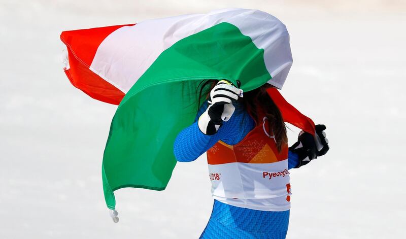 Gold medallist Sofia Goggia of Italy celebrates winning the women's downhill event. Leonhard Foeger / Reuters