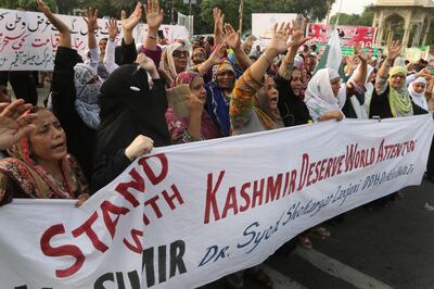 epa07758288 People shout slogans during a protest after the Indian government removed the special constitutional semi-autonomous status granted to the region of Kashmir, which both India and Pakistan claim, in Lahore, Pakistan, 05 August 2019. The Pakistani government says that India cannot change the disputed region's status due to UN Security Council resolutions on Kashmir, over which India and Pakistan have fought two wars and had many minor military conflicts.  EPA/RAHAT DAR