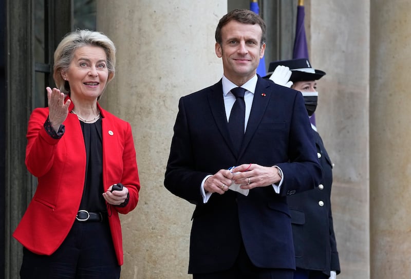 French President Emmanuel Macron greets European Commission President Ursula von der Leyen on the steps of the Elysee Palace in Paris on Friday.  AP
