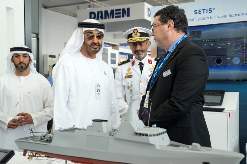 ABU DHABI, UNITED ARAB EMIRATES - February 20, 2019: HH Sheikh Mohamed bin Zayed Al Nahyan, Crown Prince of Abu Dhabi and Deputy Supreme Commander of the UAE Armed Forces (2nd L) visits Naval Group stand, during NAVDEX, at Abu Dhabi National Exhibition Centre (ADNEC).
( Ryan Carter for the Ministry of Presidential Affairs )
---