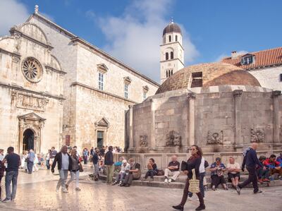 A view of Onofrio´s fountain and the Franciscan´s monastery in the Stradun, main street in Placa - the old City of Dubrovnik. Getty Images