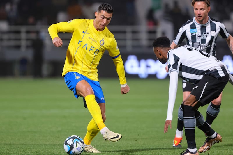 Al Nassr's Portuguese forward Cristiano Ronaldo is marked by Shabab's Saudi defender Moteb Al Harbi. AFP