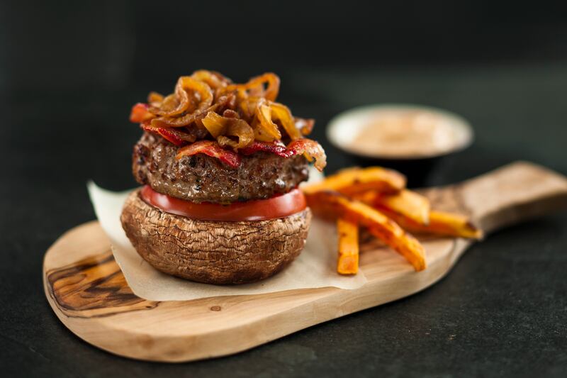 A dish from Nourishing Dubai: beef burger on mushroom bun with a side of sweet potato fries and chipotle mayo. Photo: Nourishing Dubai