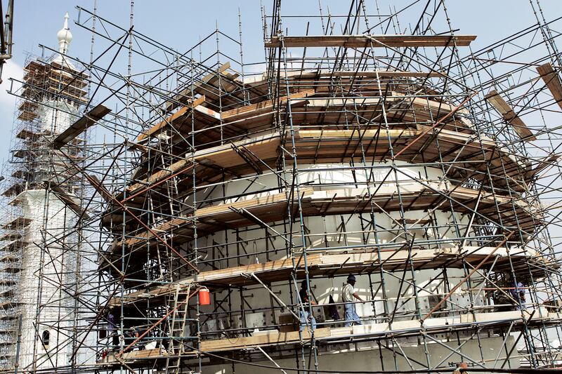 Scaffolding surrounds part of Sheikh Zayed Grand Mosque during construction. Getty Images