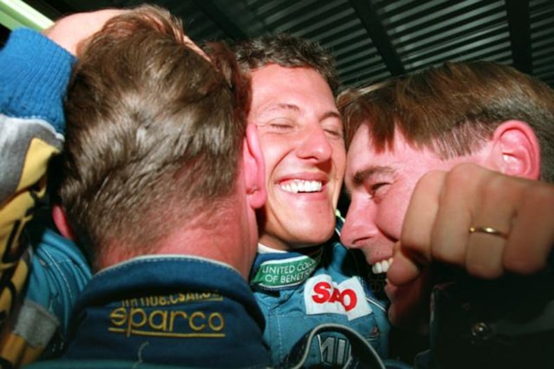 13 NOV 1994:  GERMANY's MICHAEL SCHUMACHER CELEBRATES WITH BENETTON MECHANICS ON HIS RETURN TO THE PITS AFTER BECOMING FORMULA ONE WORLD CHAMPION AT THE AUSTRALIAN GRAND PRIX, ADELAIDE. Mandatory Credit: Mike Hewitt/ALLSPORT